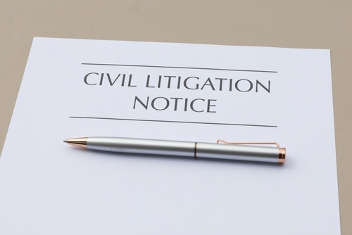 A silver pen resting on a document titled “Civil Litigation Notice,” symbolizing the first steps in a dispute handled by a Schaumburg civil litigation attorney.